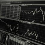 Stock trading screens show fluctuation of economic uncertainty