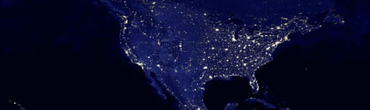North American continent electric lights map at night. Symbolizing nearshore development for US businesses.